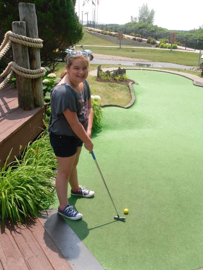 Carly golfing